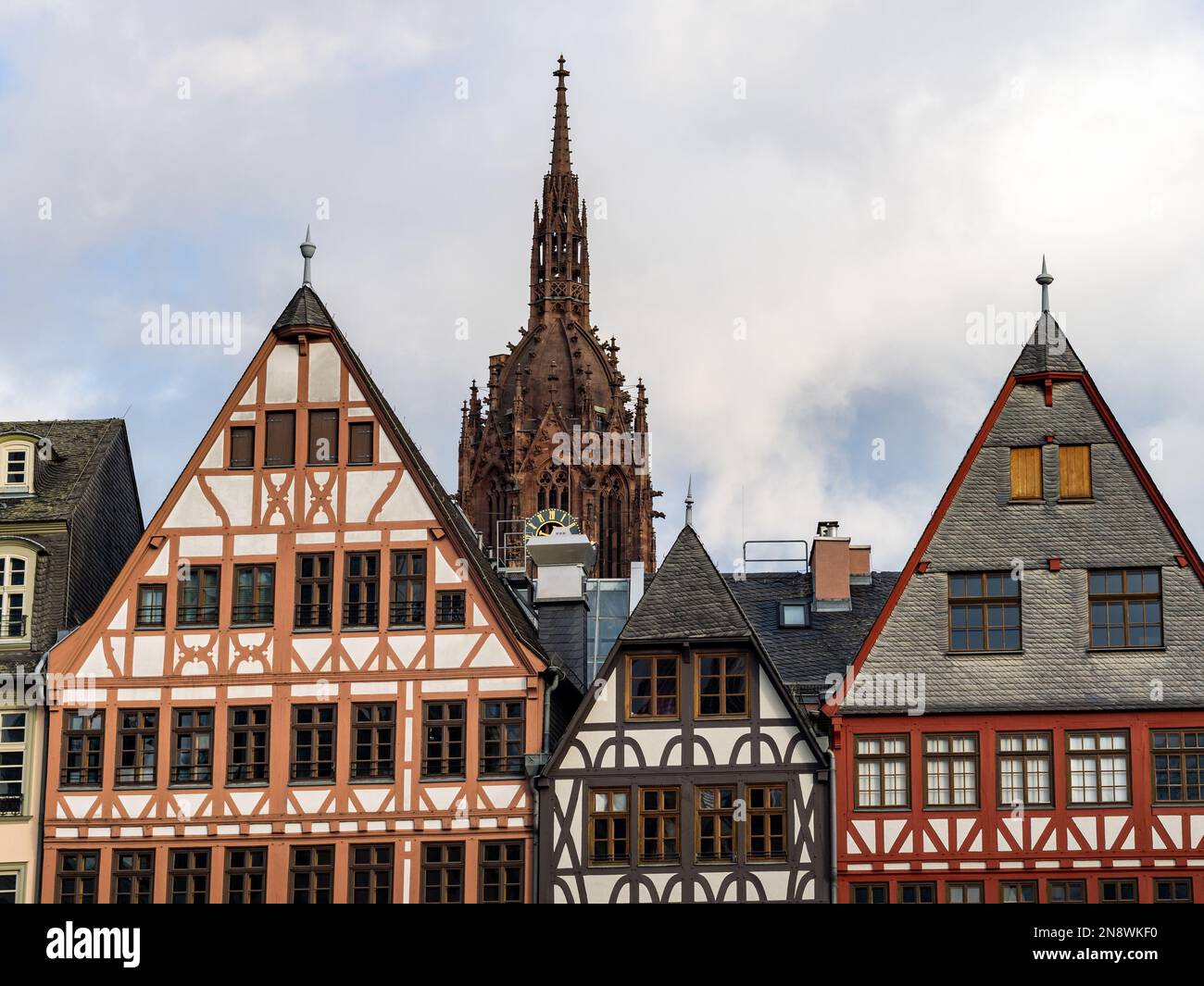 Old town architecture in the city centre. The cathedral Kaiserdom is behind the half-timbered buildings. Traditional facades are part of the exterior. Stock Photo
