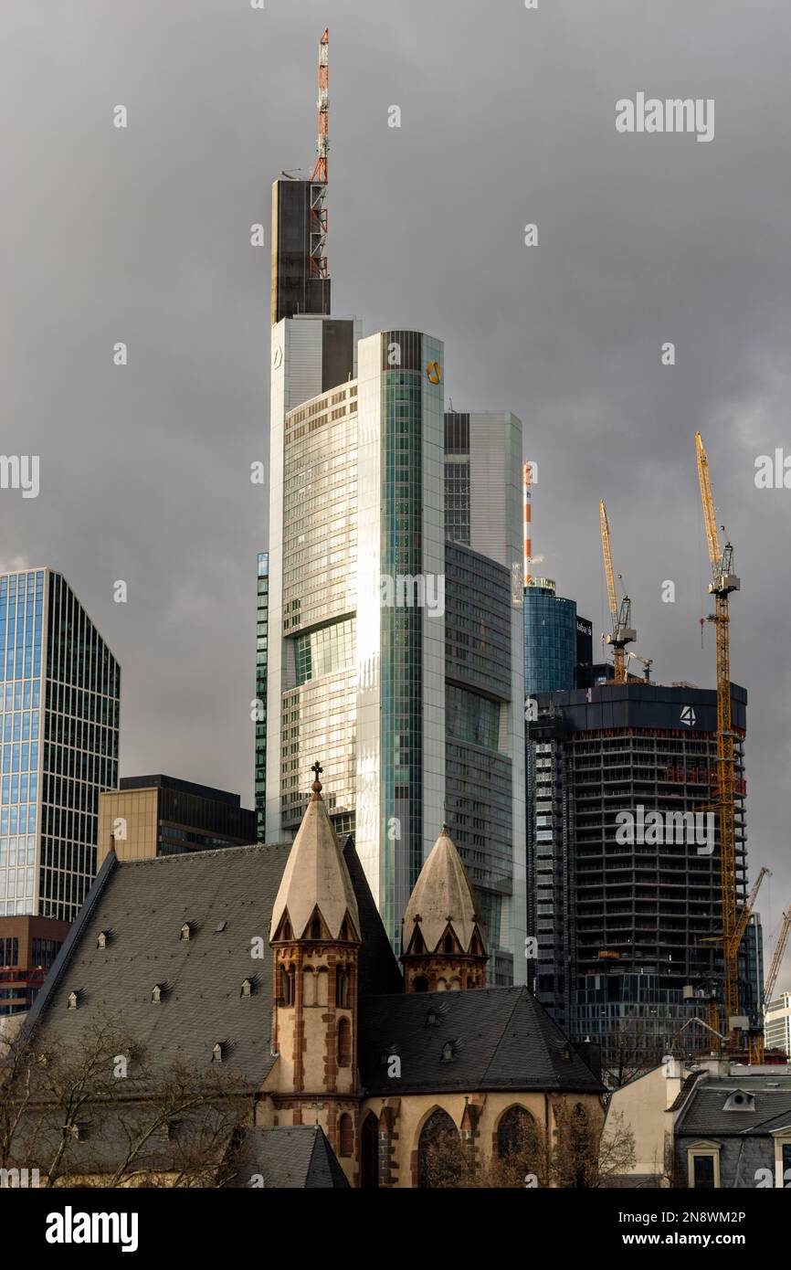 Commerzbank tower building and the St. Leonhard church. Contrast in architecture in the city. Financial banking business and religion side by side. Stock Photo