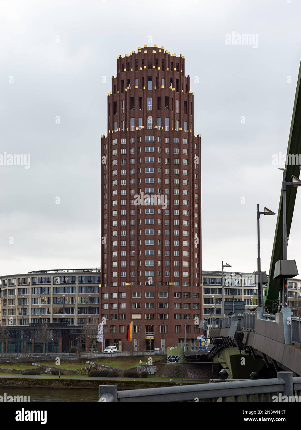 Main Plaza tower in Frankfurt Sachsenhausen. Architecture by Hans Kollhoff next to the Main river. Building exterior of the Lindner Hotel. Stock Photo