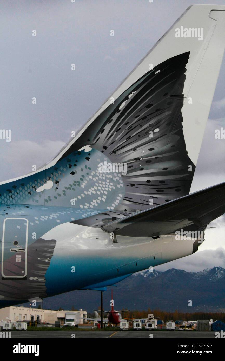 An Alaska Airlines 737800 featuring a new salmon paint design