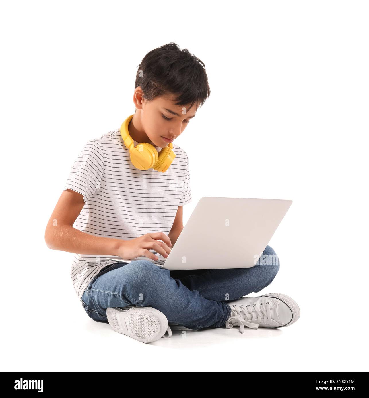Little boy using laptop on white background Stock Photo - Alamy