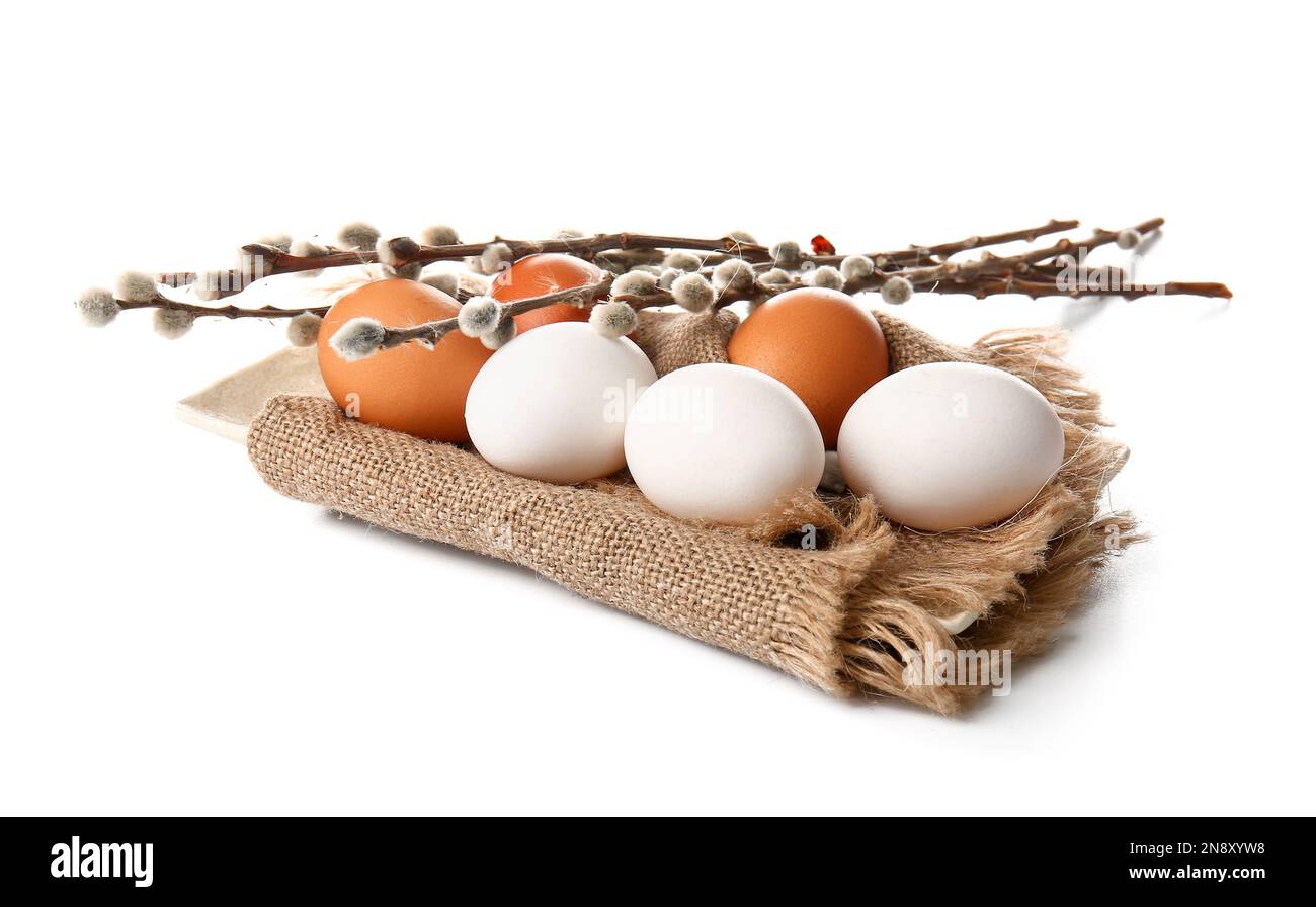 Plate with Easter eggs and willow branches on white background Stock ...