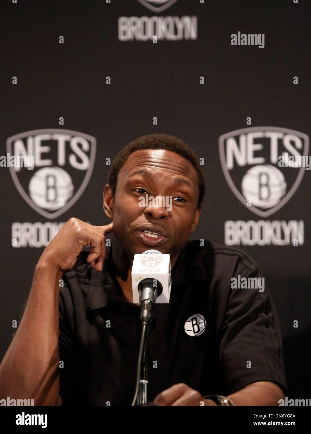 Brooklyn Nets basketball coach Avery Johnson is interviewed during team