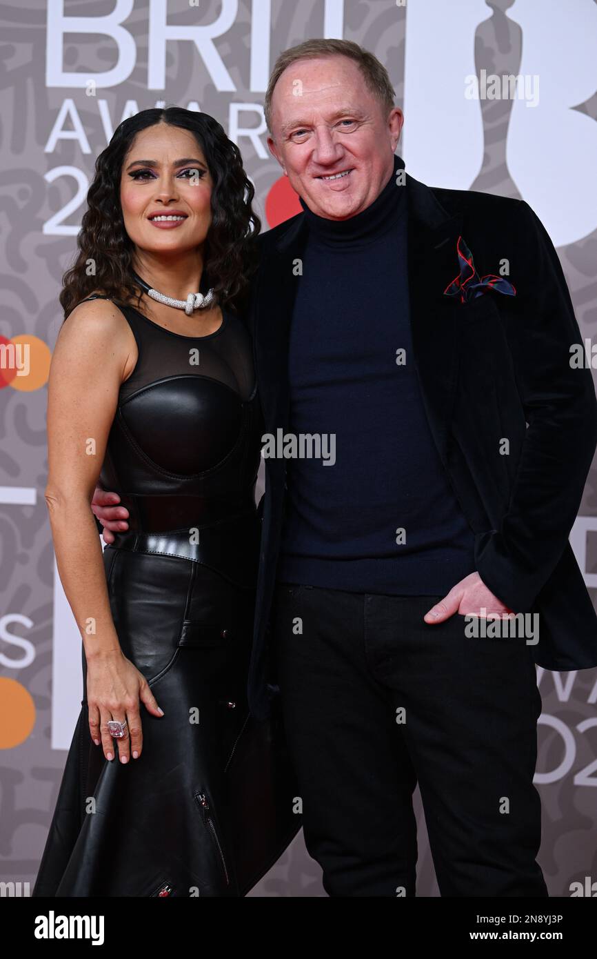 EDITORIAL USE ONLY February 11th, 2023, London, UK. Salma Hayek and Francois-Henri Pinault arriving at The BRIT Awards 2023, O2 Arena, London. Credit: Doug Peters/EMPICS/Alamy Live News Stock Photo