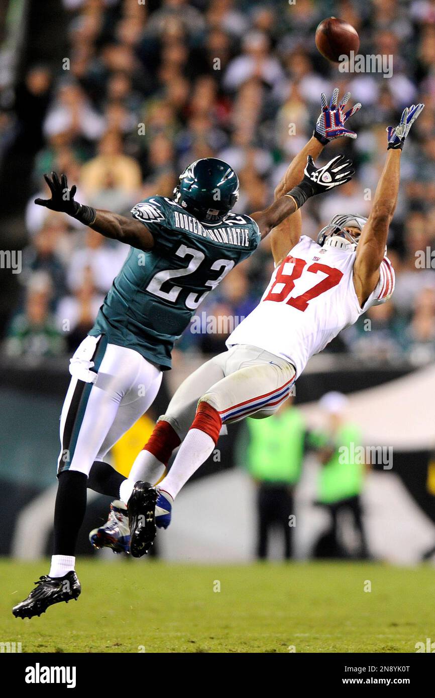 New York Giants wide receiver Domenik Hixon right makes a catch against Philadelphia Eagles cornerback Dominique Rodgers Cromartie during the first half of an NFL football game Sunday Sept. 30 2012 in...