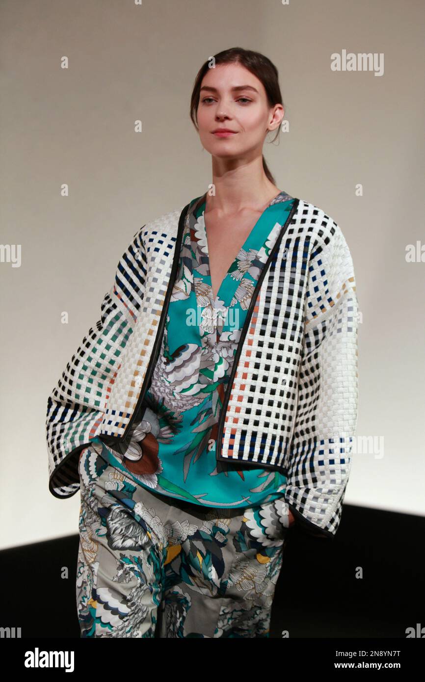 A model wears a creation by French designer Louis Vuitton as part of the  women's ready to wear spring/summer 2012 collection presented during the  Paris Pret-a-Porter fashion week, in Paris, France, 5