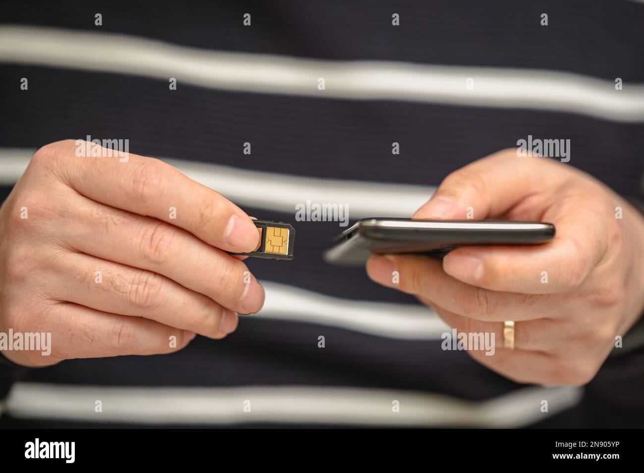 SIM card replacement in the phone. Mobile Simcard Stock Photo