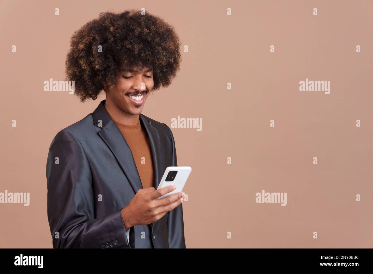 Happy african man using the mobile phone Stock Photo