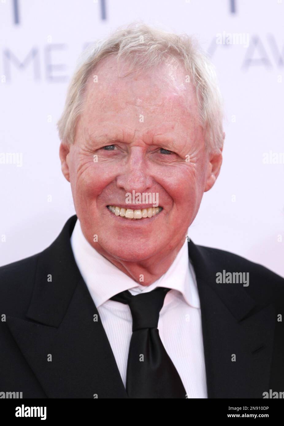 Producer Bertram Van Munster arrives at the 64th Primetime Emmy Awards