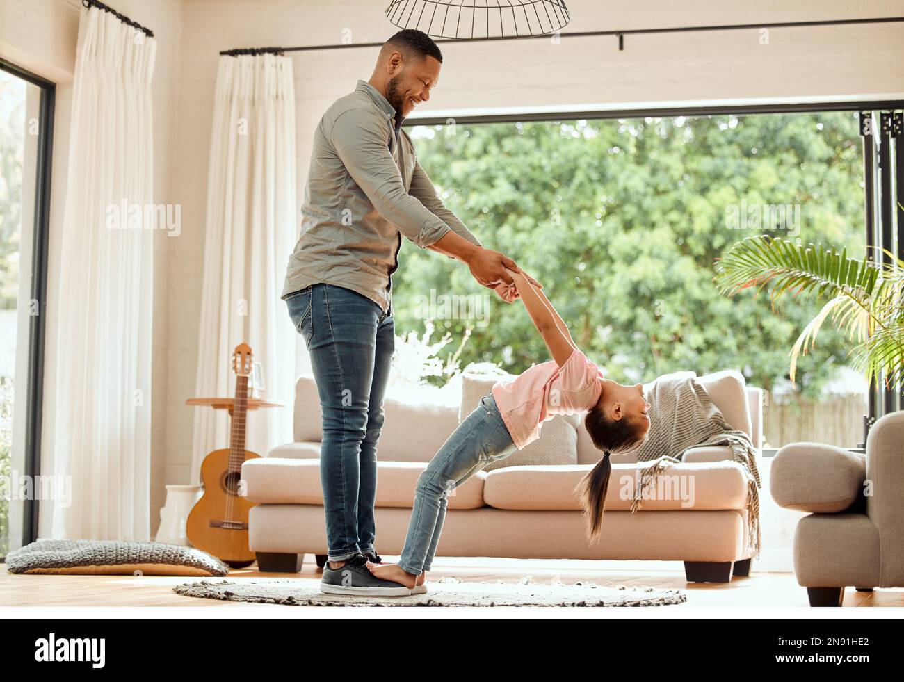 My dad always has time for a dance. a father practicing a dance routine ...
