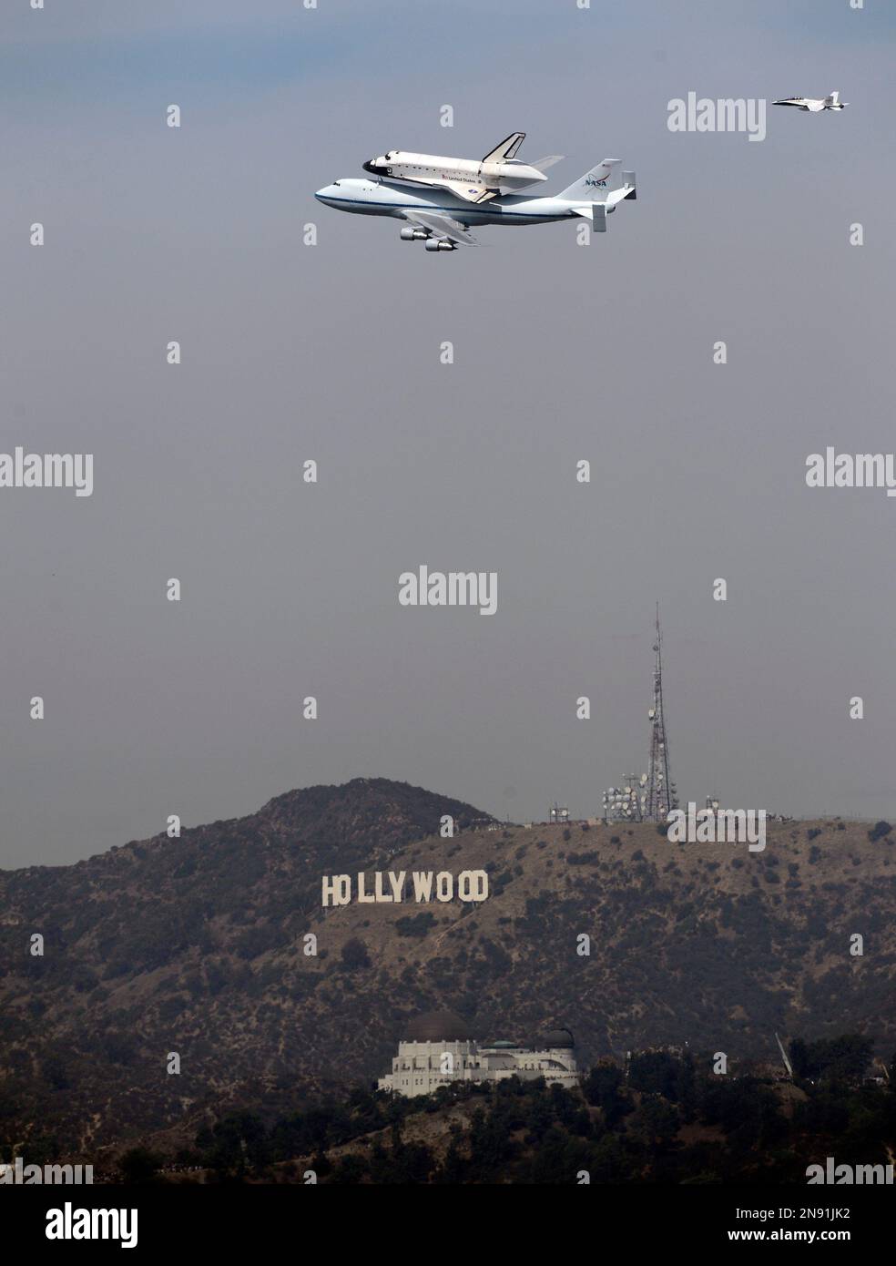 The Space Shuttle Endeavour atop a modified 747 passes the Hollywood ...