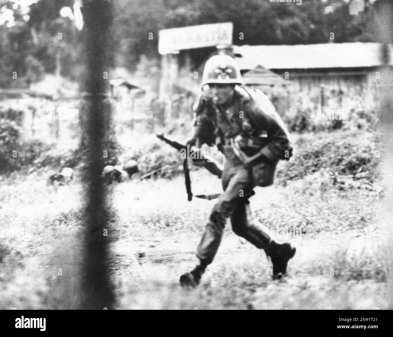 Vietnam Ranger Rto A South Vietnamese Ranger clutches equipment to his body as he dashes ...