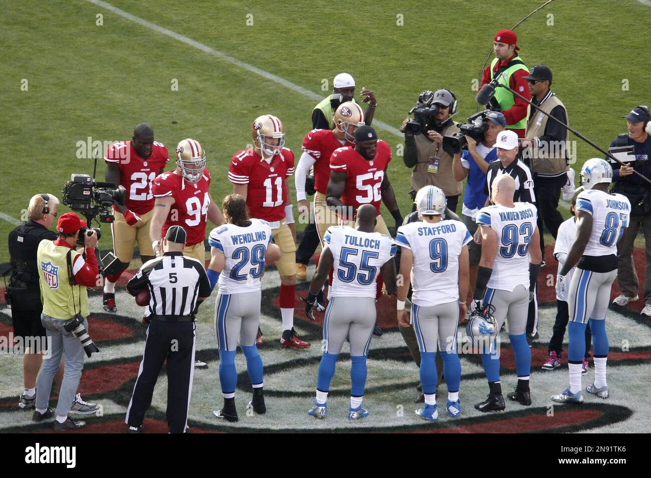 The San Francisco 49ers and Detroit Lions take part in a coin toss