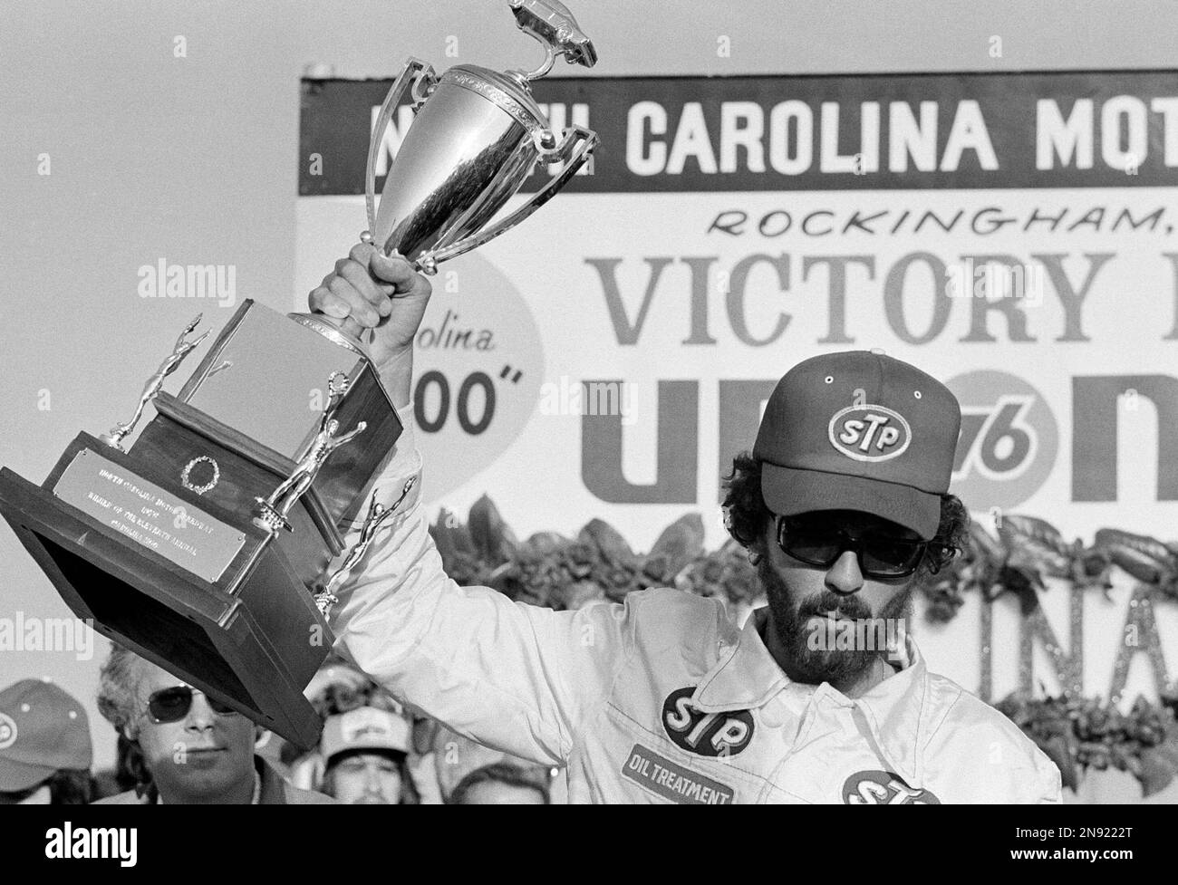 Richard Petty, of Randleman, N.C., holds up trophy after winning the ...