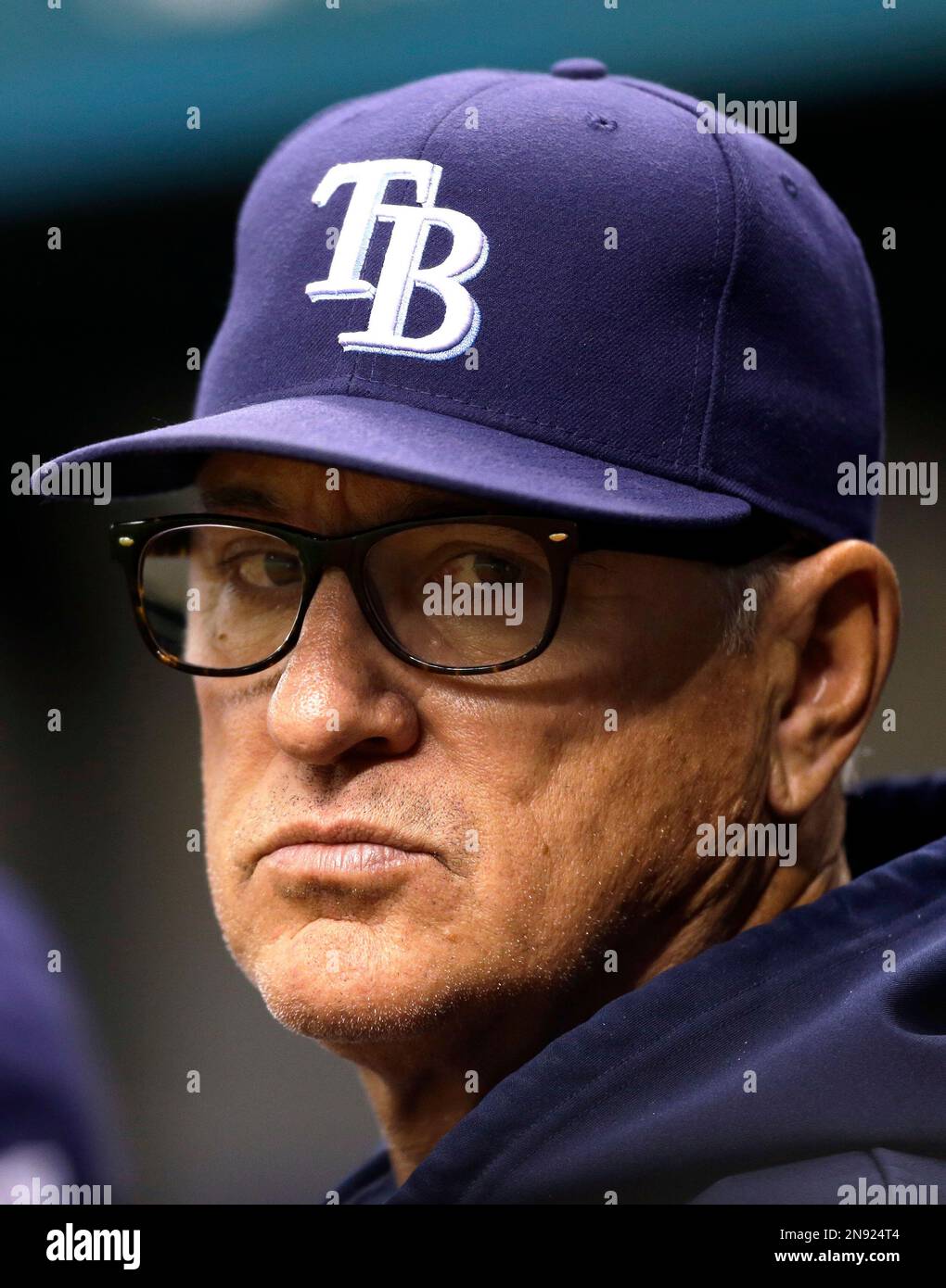 Tampa Bay Rays Manager Joe Maddon leaves the field after the Rays defeated  the Boston Red Sox 3-1 to win the American League Championship at Tropicana  Field in St. Petersburg, Florida on