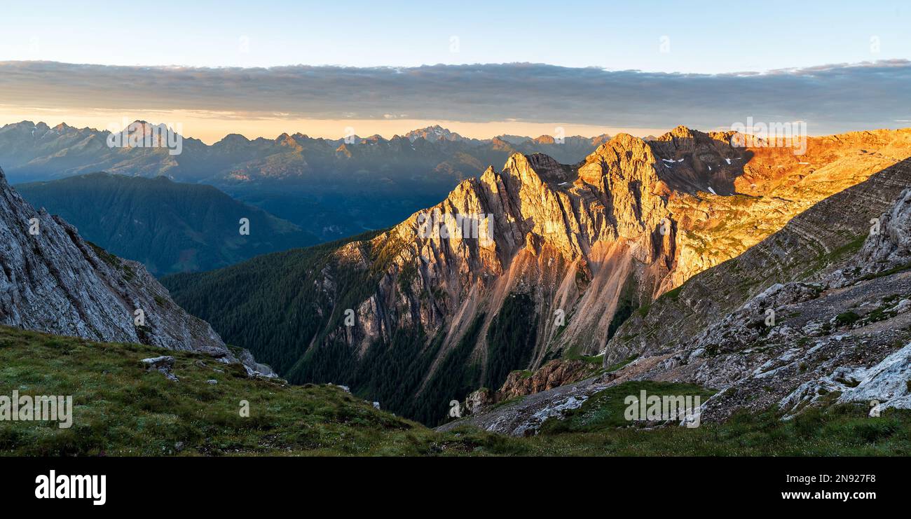 View from Bivacco Mario Rigatti in Latemar mountain group in Dolomites mountains in Italy during beautiful early morning with nearer peaks pf Latemar Stock Photo