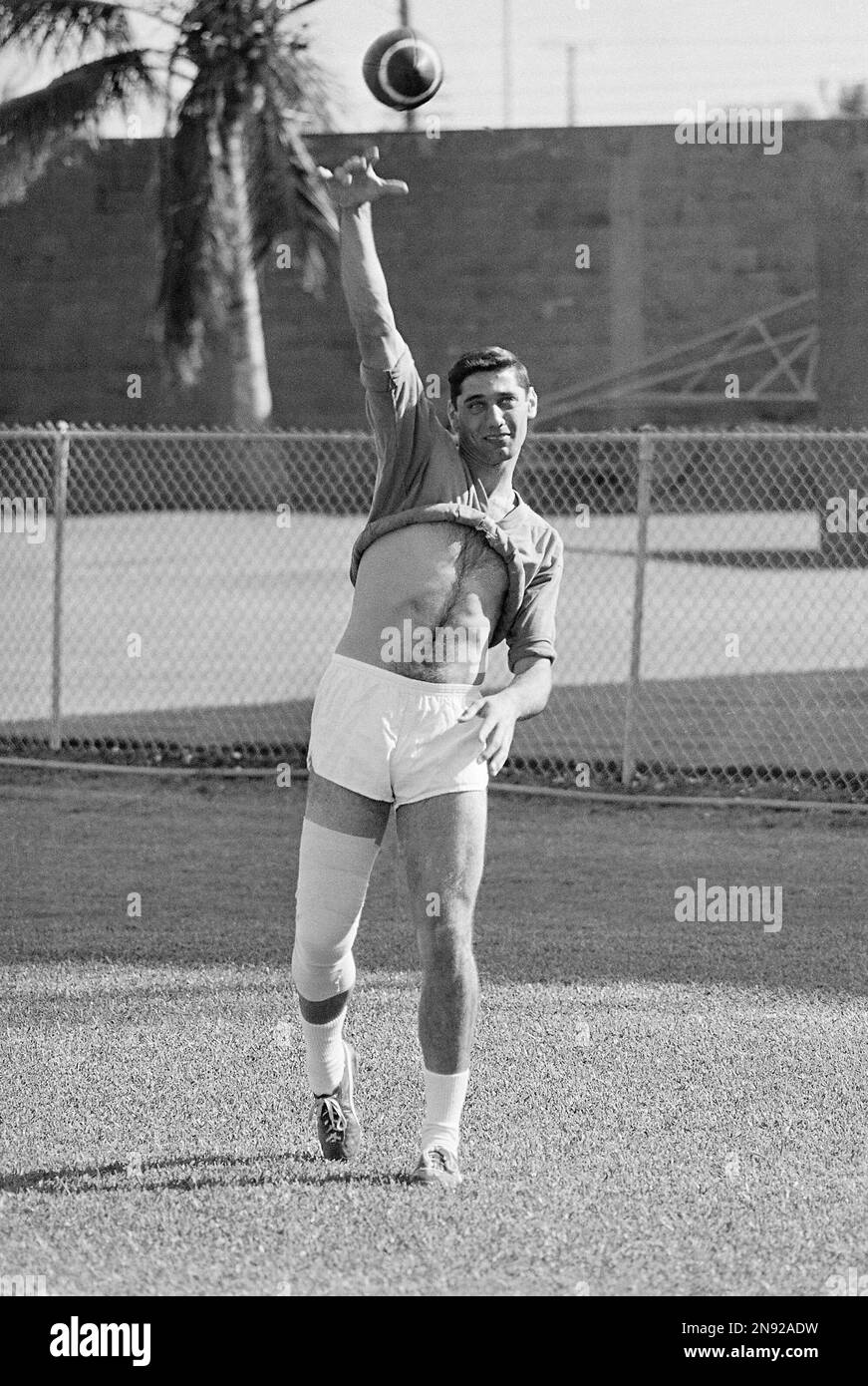 Joe Namath, University of Alabama quarterback and star passer, may have leg  trouble but the bandaged knee didn't interfere with his arm action. He  worked out with the squad, December 31, 1964