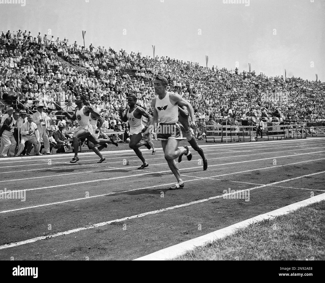 Harold L. Davis, right, San Francisco Olympic Club, wins the 100meter