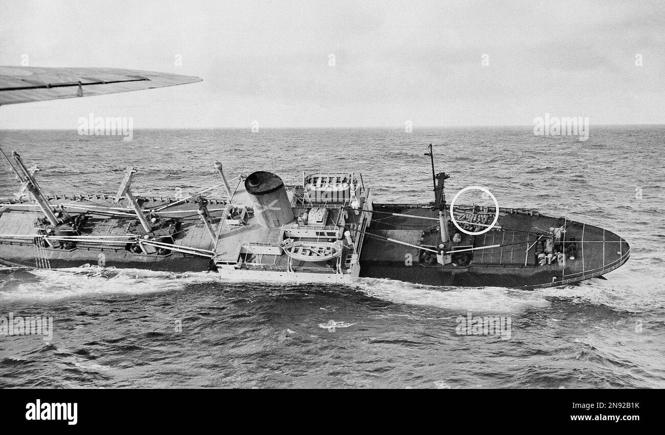 Capt. Kurt Carlsen, circled, leans against rail of the foundering