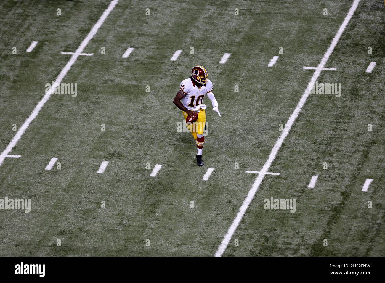Washington Redskins quarterback Robert Griffin III drops back to pass ...