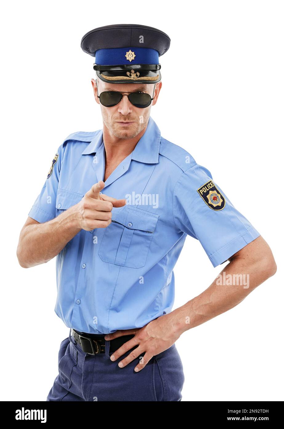 Security, officer and portrait of police point on white background for