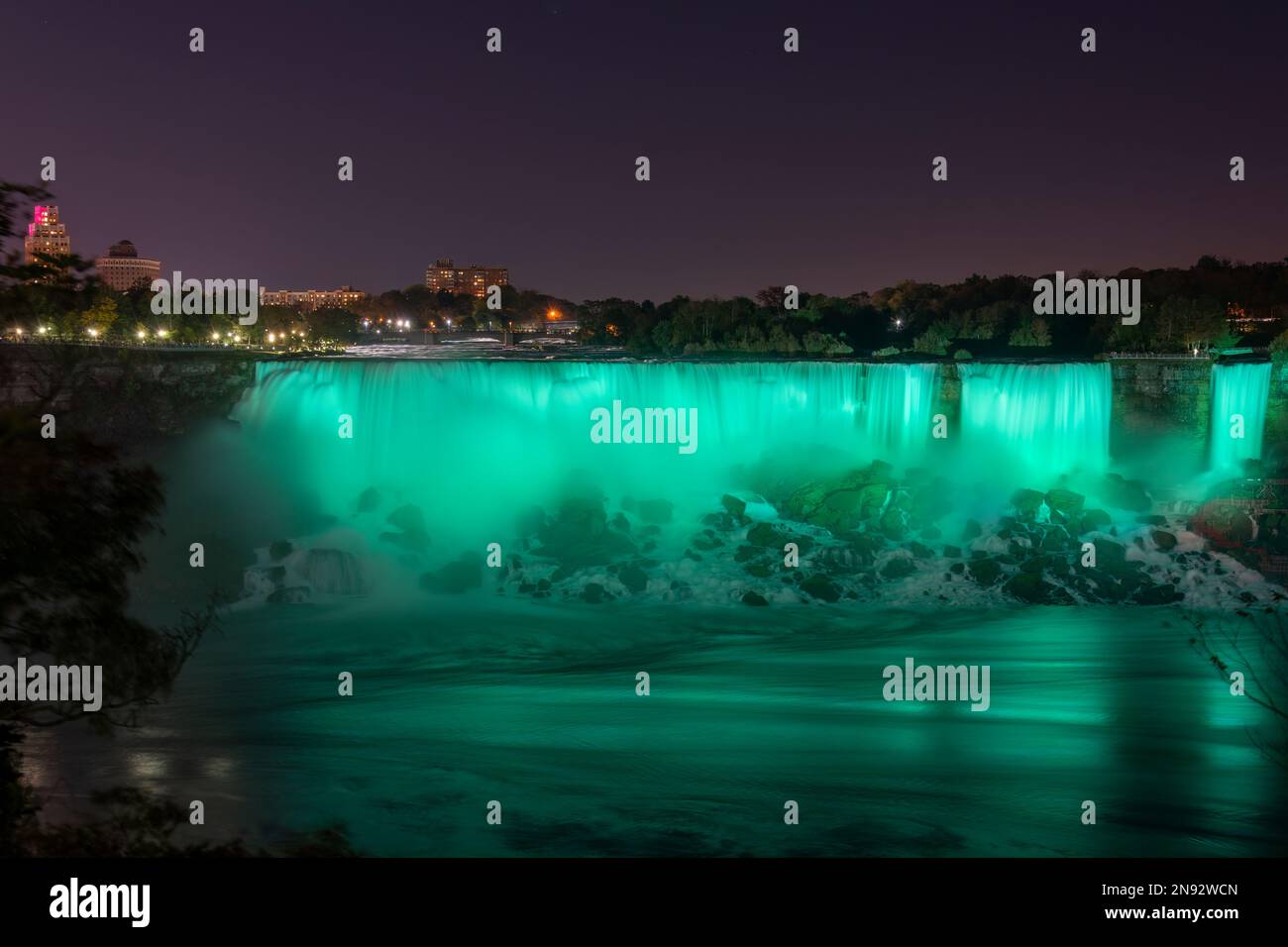 Niagara Falls lit up in green. Ontario, Canada. Stock Photo