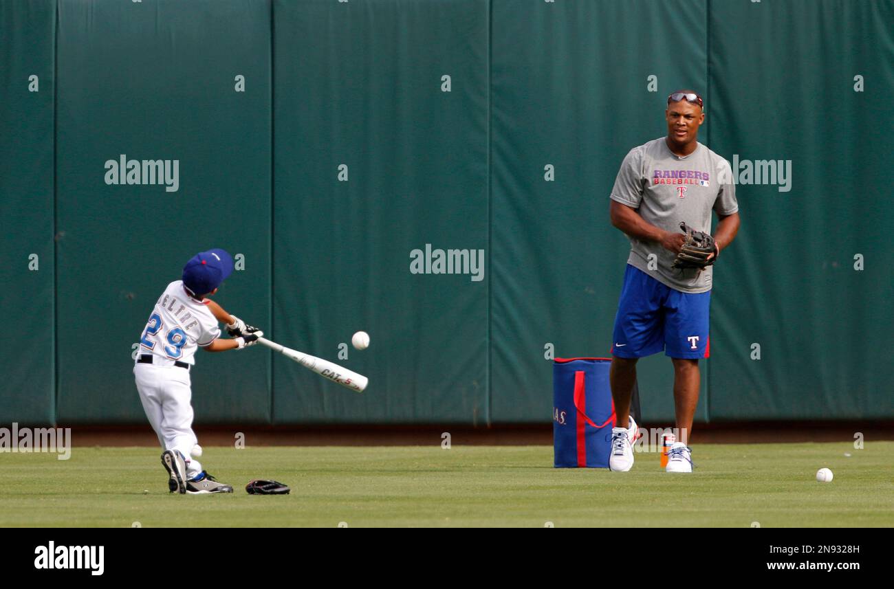 The Texas Rangers' Adrian Beltre and his son, Adrian Jr., 8, walk out for  practice in spring training in Surprise, Ariz., Thursday, Feb. 26, 2015.  (Photo by Rodger Mallison/Fort Worth Star-Telegram/TNS) *** Please Use  Credit from Credit Field *** Sto