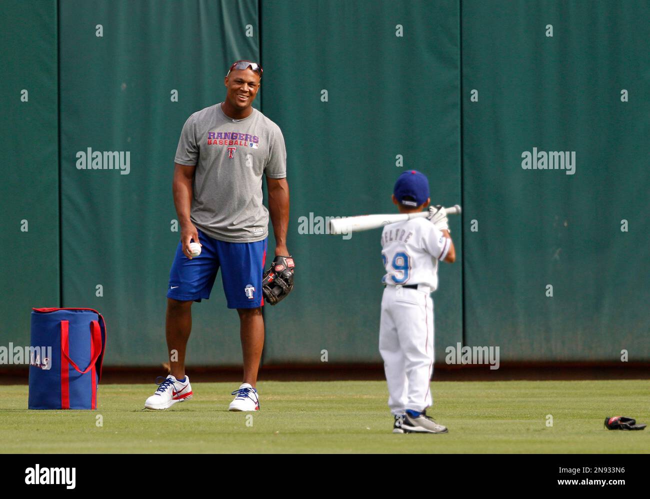 The Texas Rangers' Adrian Beltre and his son, Adrian Jr., 8, walk out for  practice in spring training in Surprise, Ariz., Thursday, Feb. 26, 2015.  (Photo by Rodger Mallison/Fort Worth Star-Telegram/TNS) *** Please Use  Credit from Credit Field *** Sto