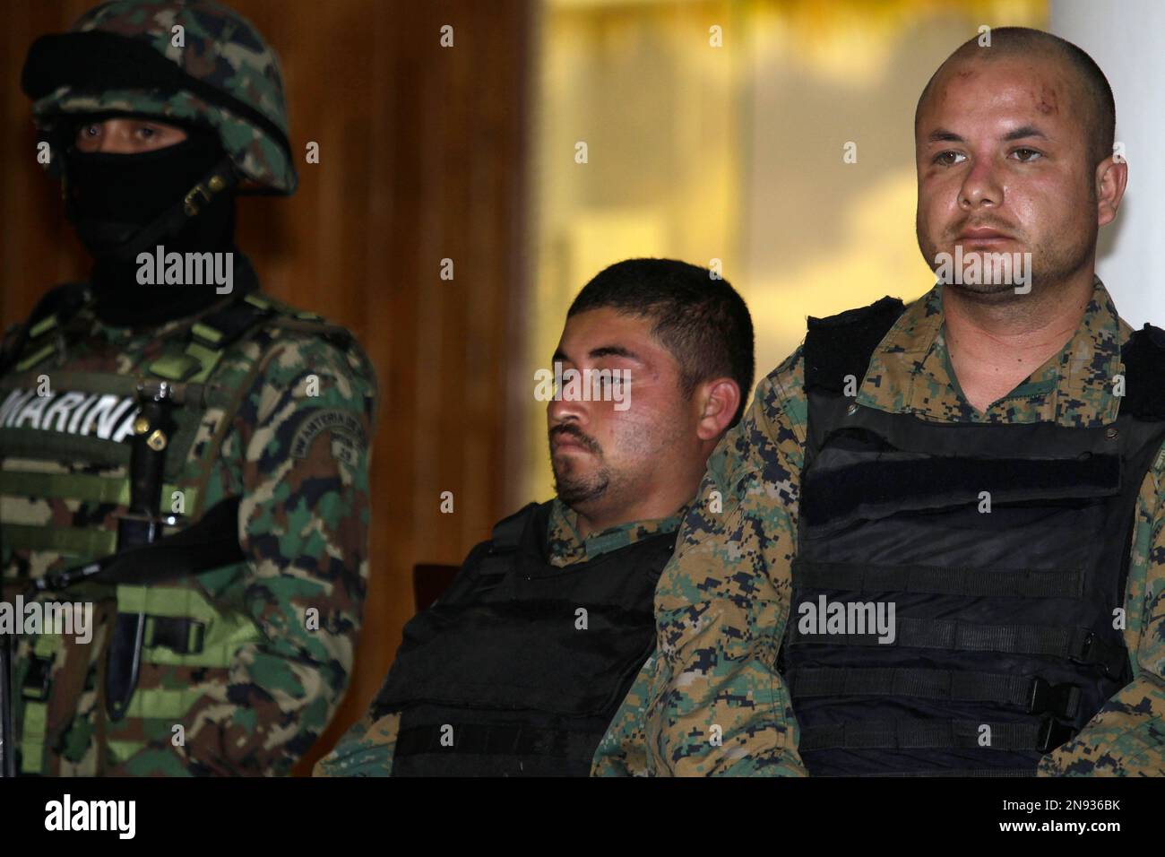 Two Men Wearing Bulletproof Vests And Camouflage Military Fatigues And Believed To Be Bodyguards 9267