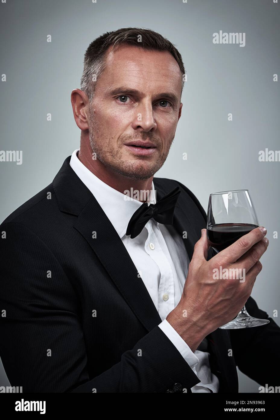 Tuxedo, red wine and spy man with alcohol in a suit feeling classy with ...