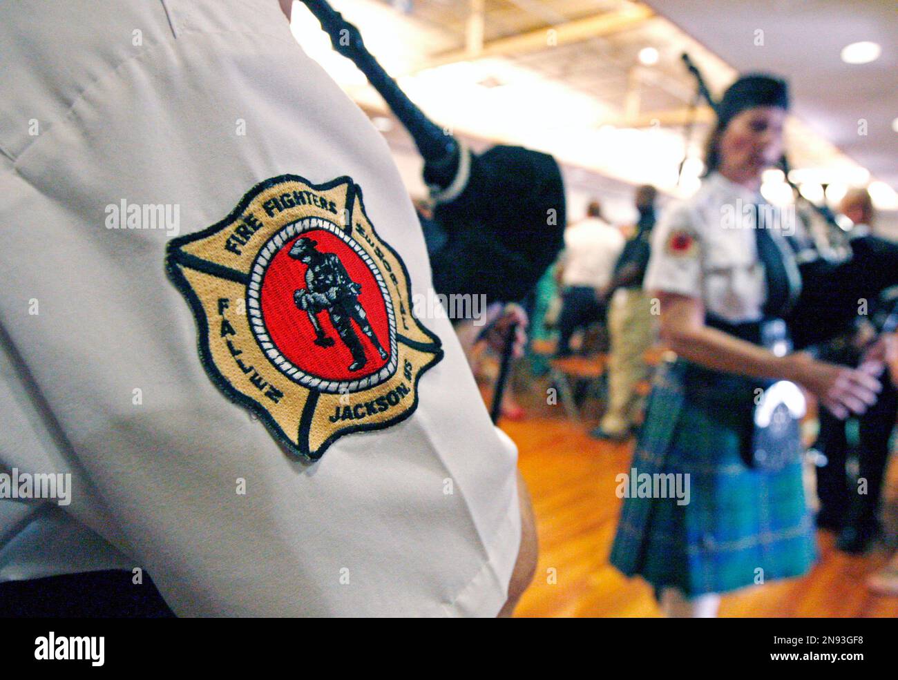 Bagpipe playing members of the Father of Waters Pipes and Drums corps