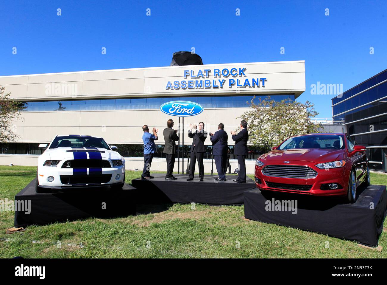Mark Fields, center, Ford president of the Americas and others applaud as  the signage is unveiled for the Flat Rock Assembly Plant in Flat Rock,  Mich., Monday, Sept. 10, 2012. The plant,