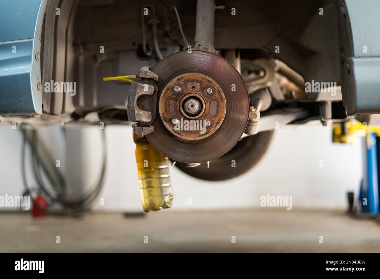 Automatic change of brake fluid in a car service Stock Photo Alamy