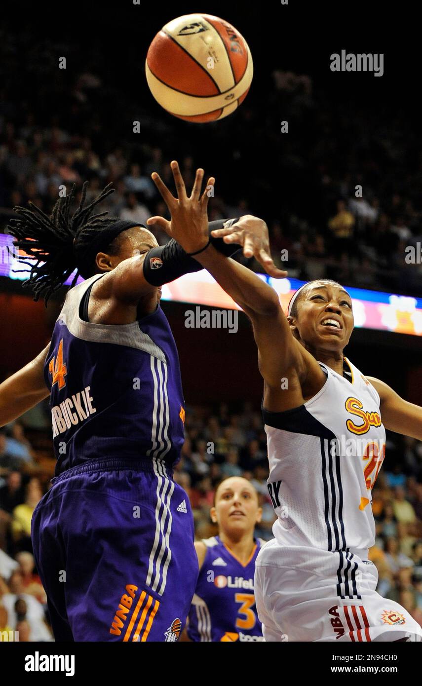 Connecticut Sun's Renee Montgomery, right, is fouled by Phoenix Mercury