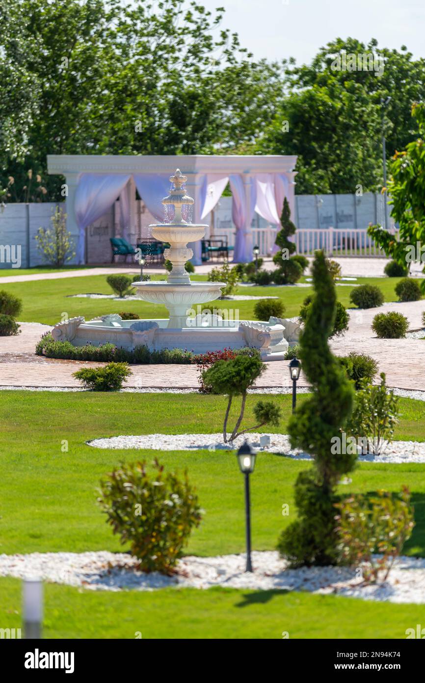 A view of the yard with water fountain and green nature. Stock Photo