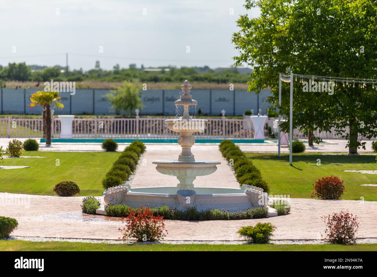 A view of the yard with water fountain and green nature. Stock Photo