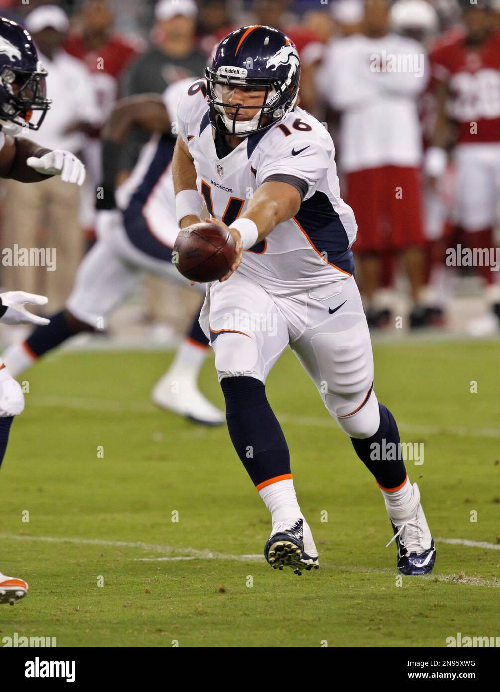 Denver Broncos quarterback Caleb Hanie (16) hands off against the