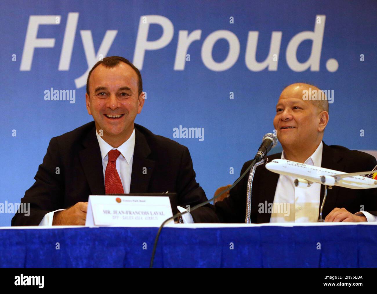 Jean-Francois Laval, left, Senior Vice President for Sales Asia of Airbus  and Ramon S. Ang, President and COO of Philippine Airlines announce in a  news conference Tuesday Aug. 28, 2012 in Manila,