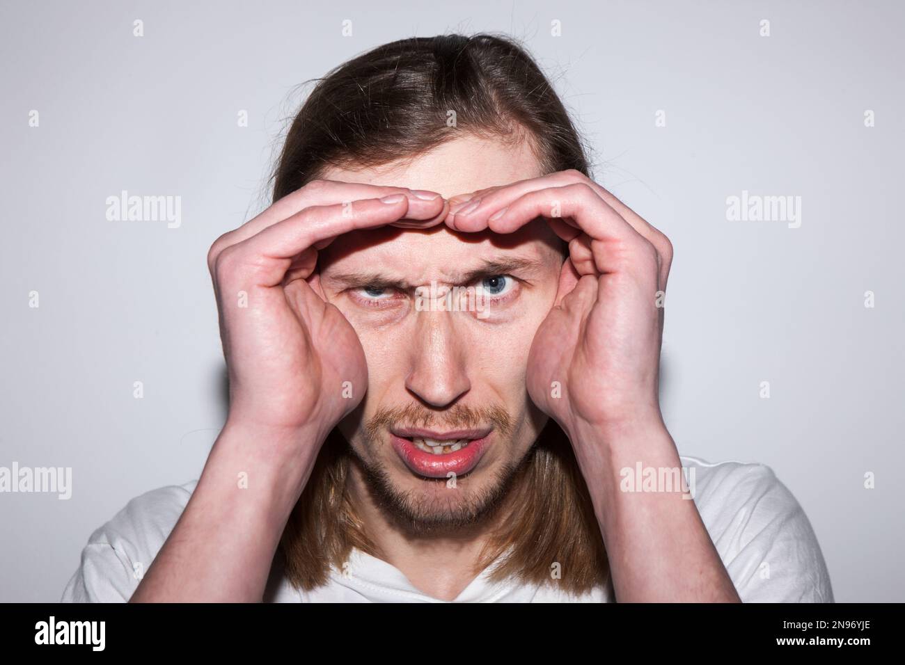 Uncertain Uncertain male searching information hi-res stock photography and ...