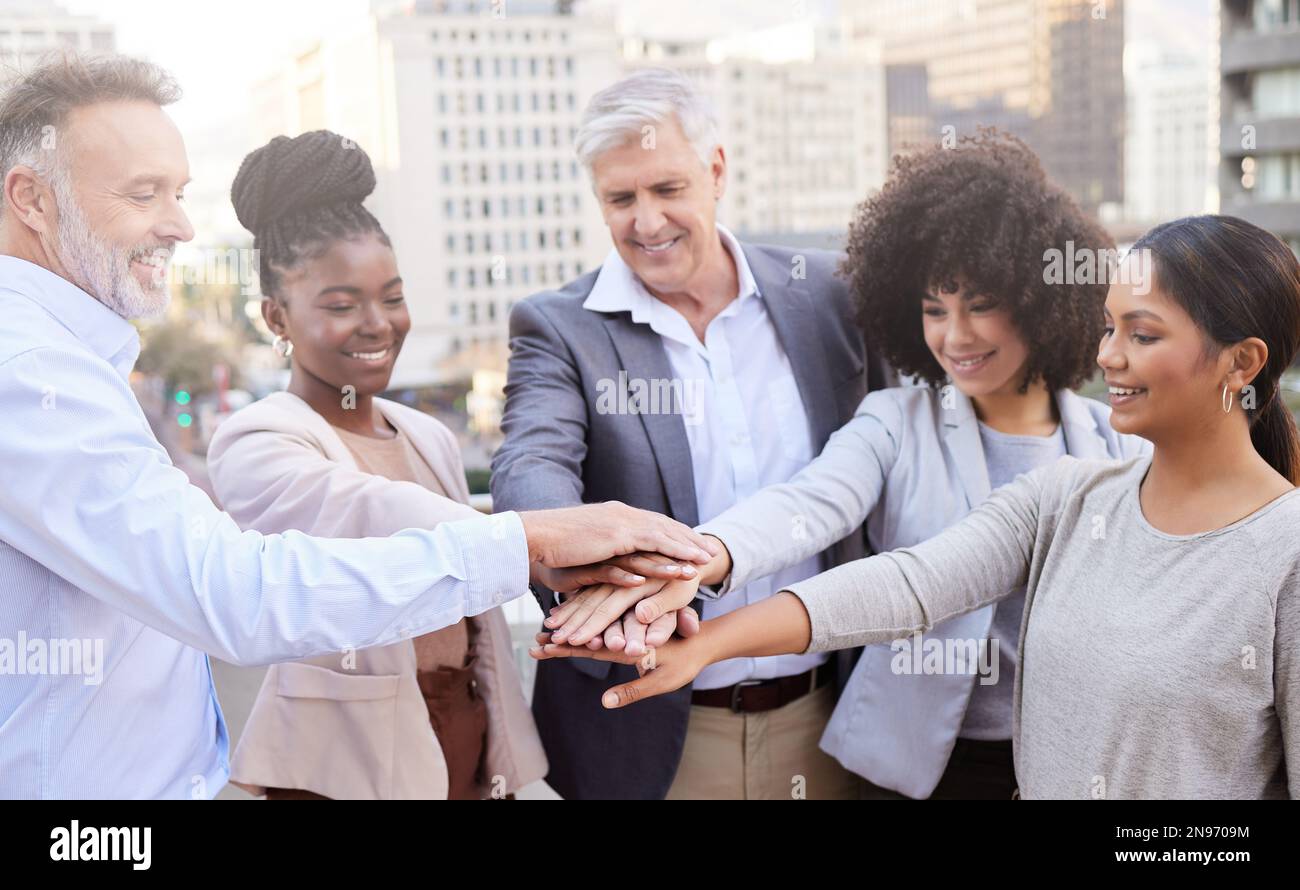 We can do this together. a diverse group of businesspeople standing ...