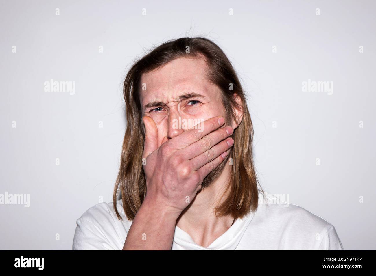 Scared crying male. Bad news for man Stock Photo Alamy