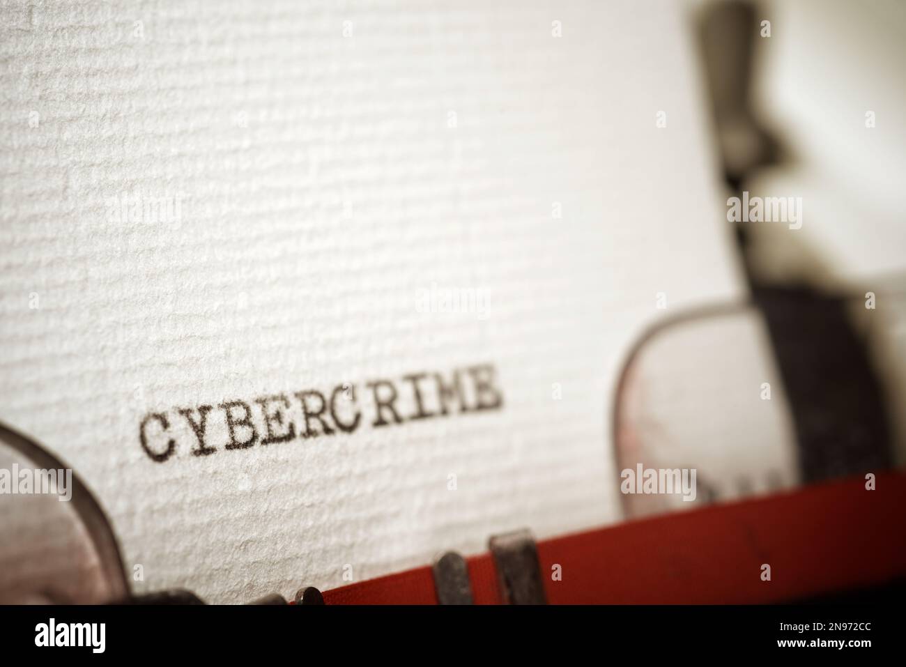 Cybercrime word written with a typewriter. Stock Photo