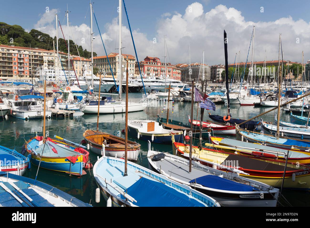 France, Nice, old wooden and colourful fishing boats in the harbour. Stock Photo
