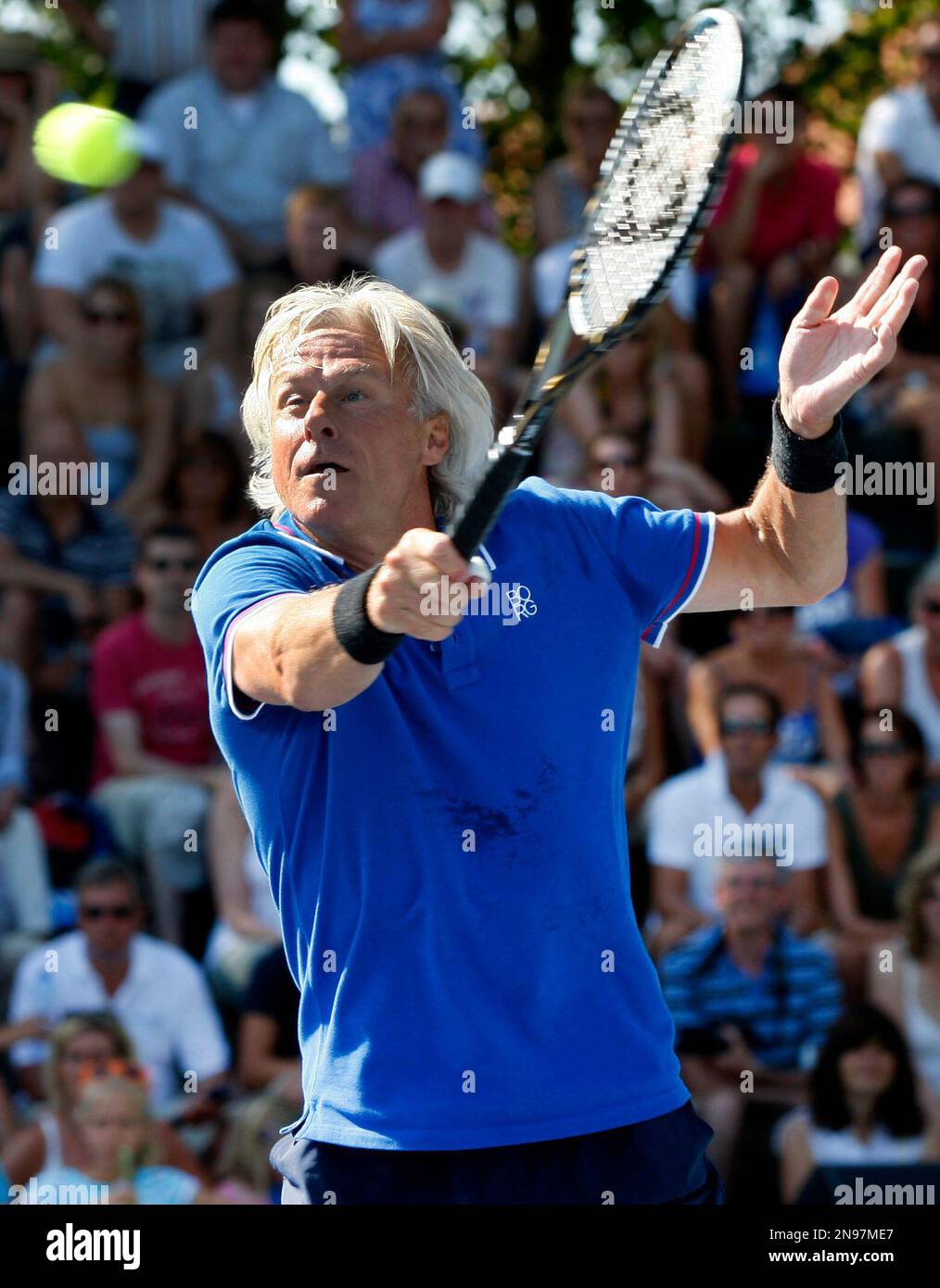 Sweden's Bjorn Borg returns the ball to Paraguay's Victor Pecci during  their exhibition tennis match in Asuncion May 16, 2009. This match was  played to commemorate the 1979 Roland Garros French Open