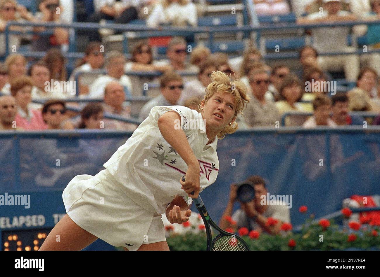 Steffi Graf follows through on a serve against Patricia Tarabini in the