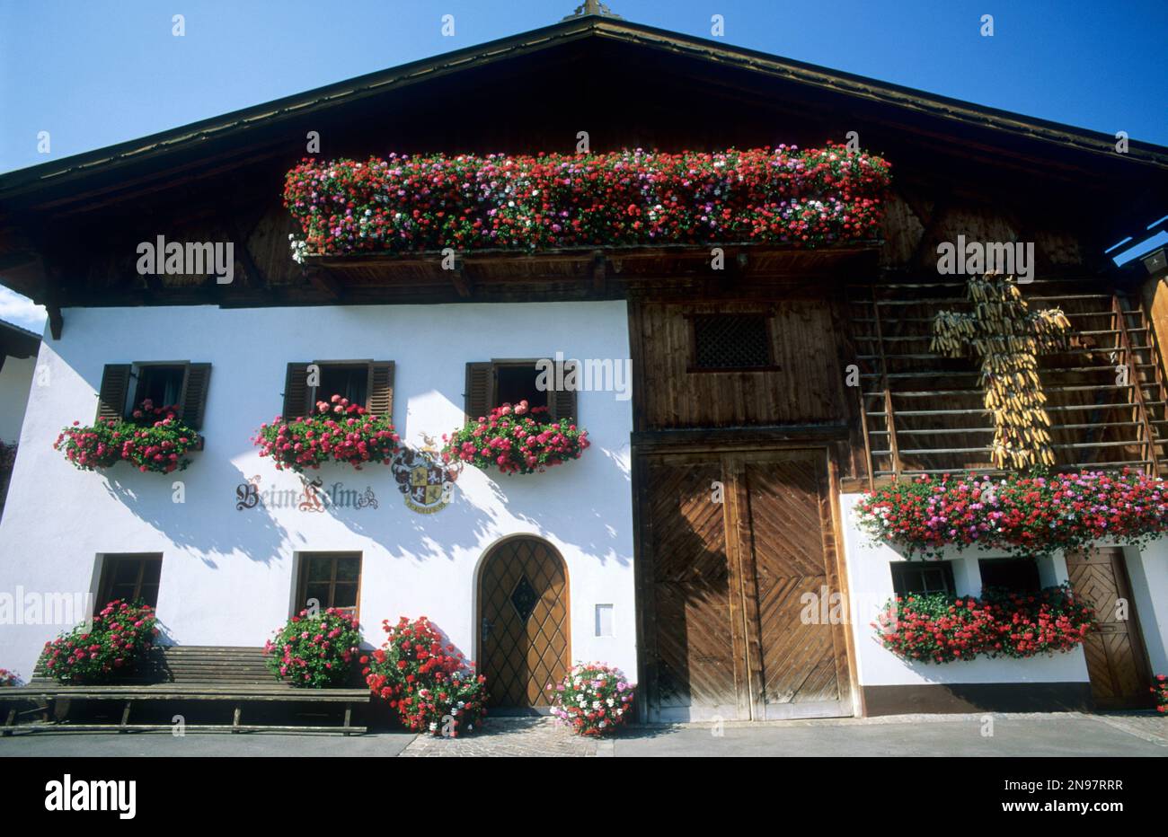 Austria, Mutters, Austrian Tirol, traditional house with flower box windows as can be seen all over Austria. Stock Photo