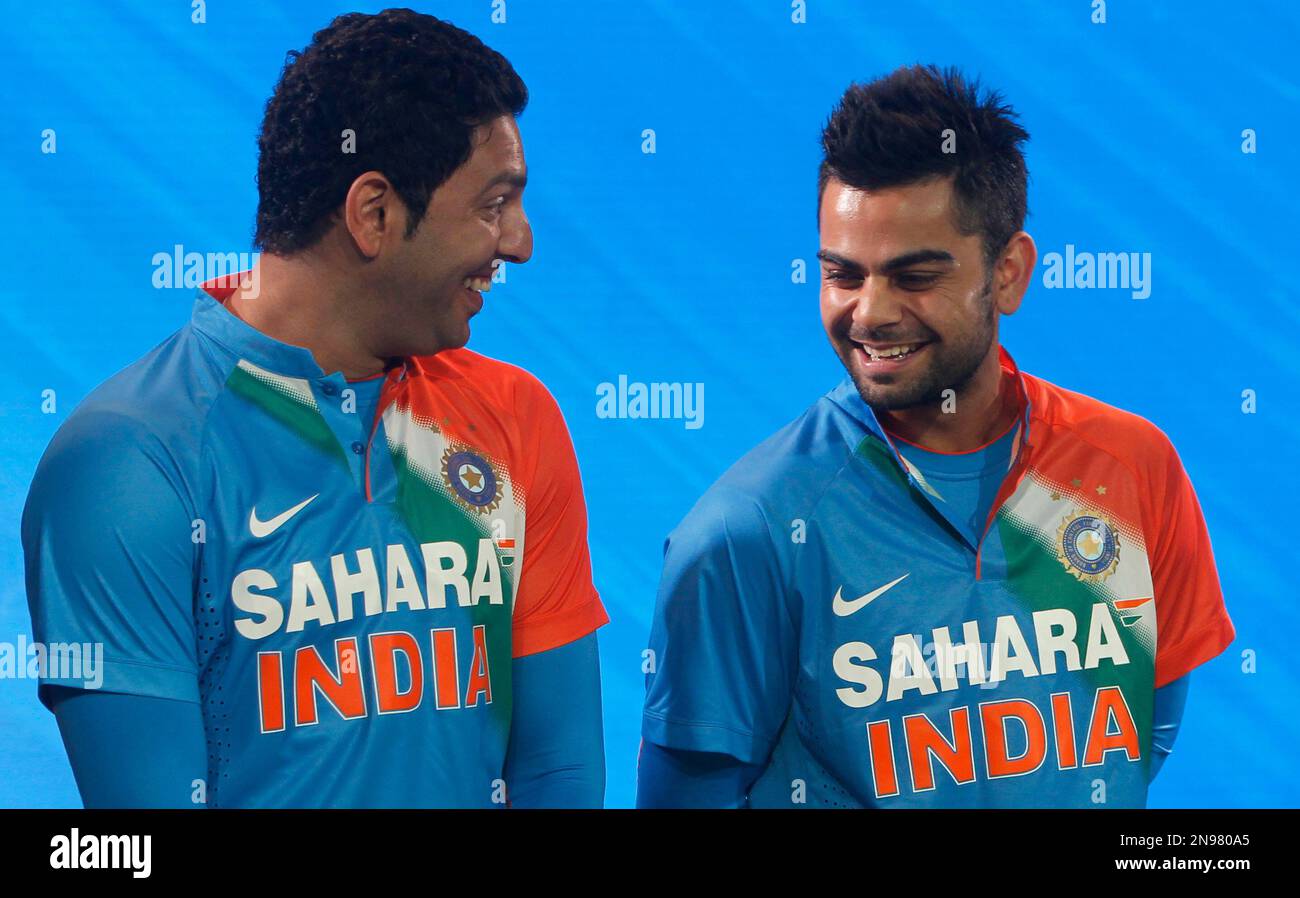 Indian cricketer Yuraj Singh, left, shares a light moment Virat Kohli at the unveiling of a new innovative T20 kit for Team Nike in Mumbai, Thursday, Aug 16, 2012.(AP Photo/Rafiq Maqbool Stock Photo - Alamy