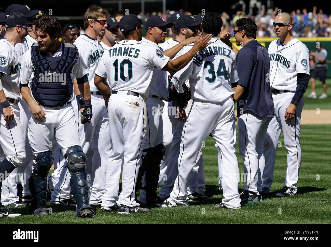 Seattle Mariners pitcher Felix Hernandez is greeted by teammates after he  threw a perfect baseball game against the Tampa Bay Rays, Wednesday, Aug.  15, 2012, in Seattle. (AP Photo/Ted S. Warren Stock