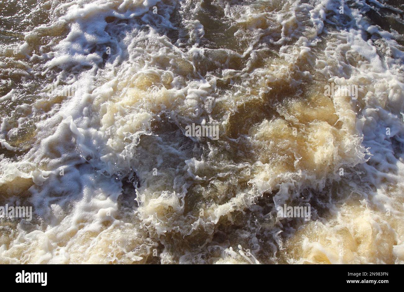 A close up of turbulent water. Fast current of a raging river. Stock Photo