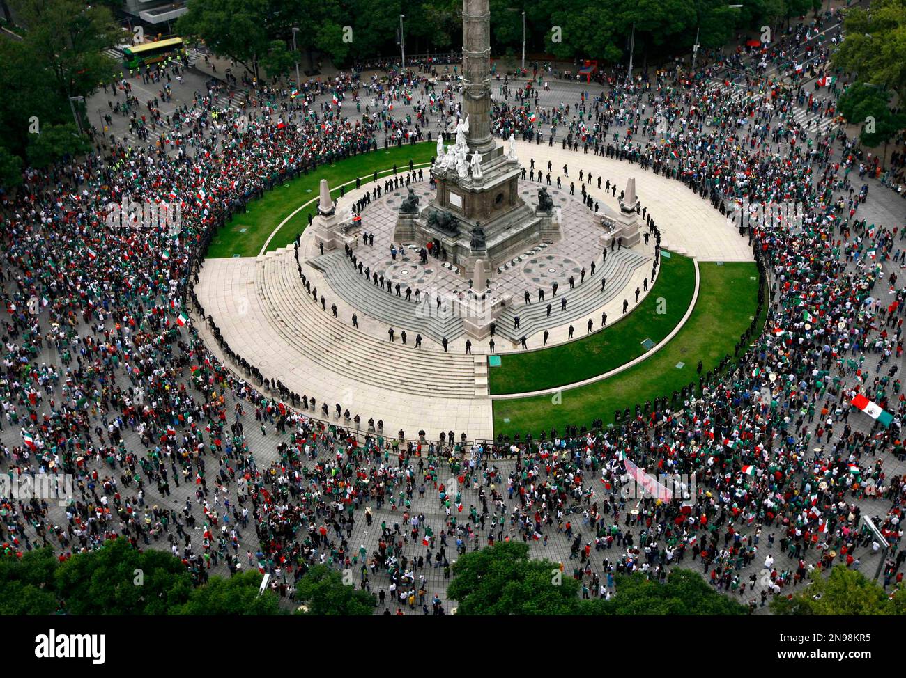Fans of Mexico's soccer team gather at the Angel of Independence